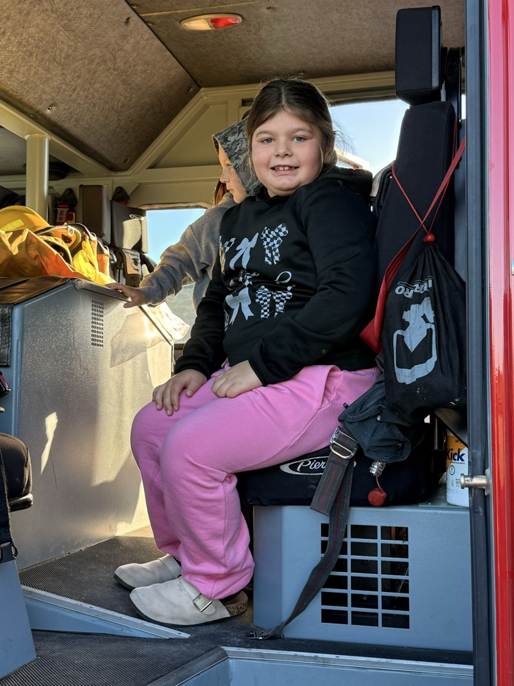 student in fire truck
