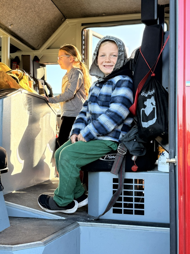 student in fire truck