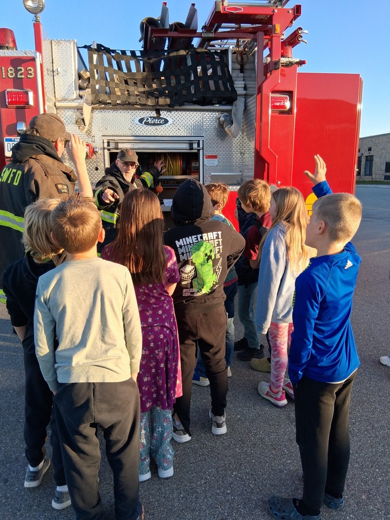 students viewing fire truck