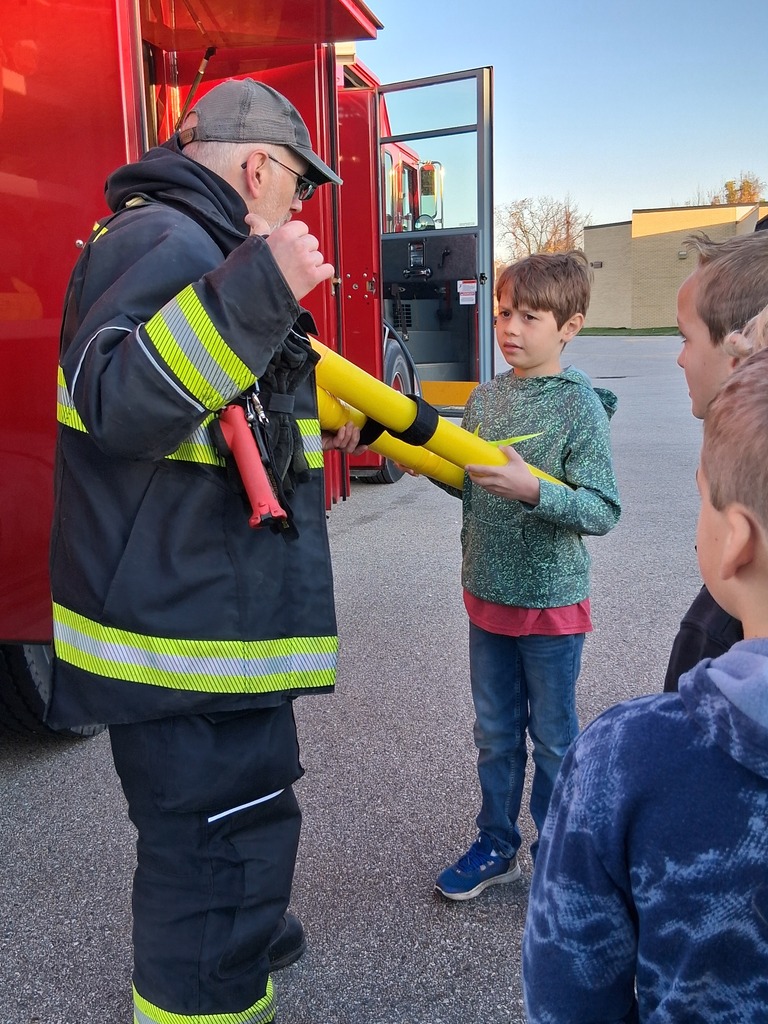 students with firemen