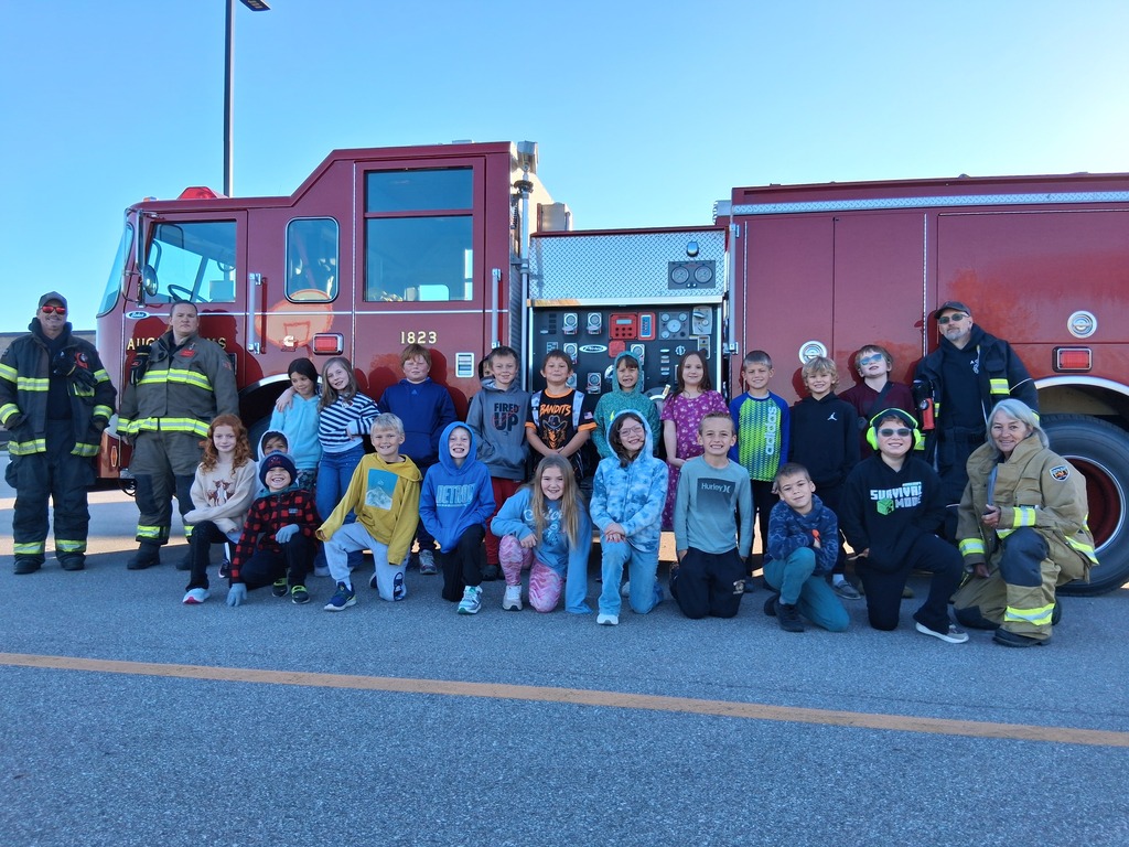 students in front of fire truck