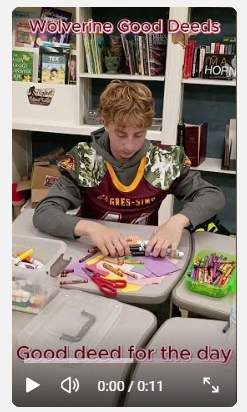 student surrounded by crafting supplies on the desk
