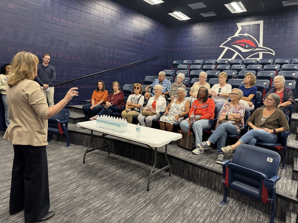 Aubrey ISD Superintendent Dr. Shannon Saylor speaking with Chaparral Legacy Cooperative in athletics lecture hall in multipurpose facility