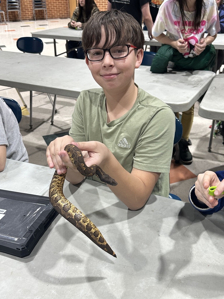 Student holding snake