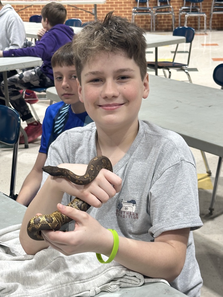 Student holding snake