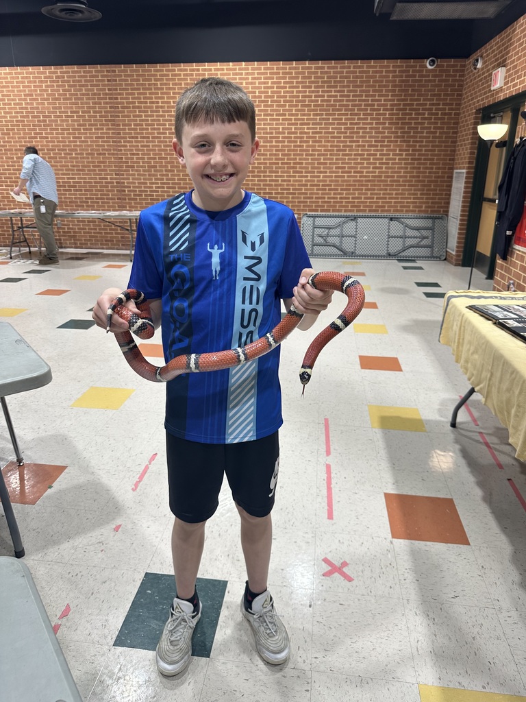 Student holding snake