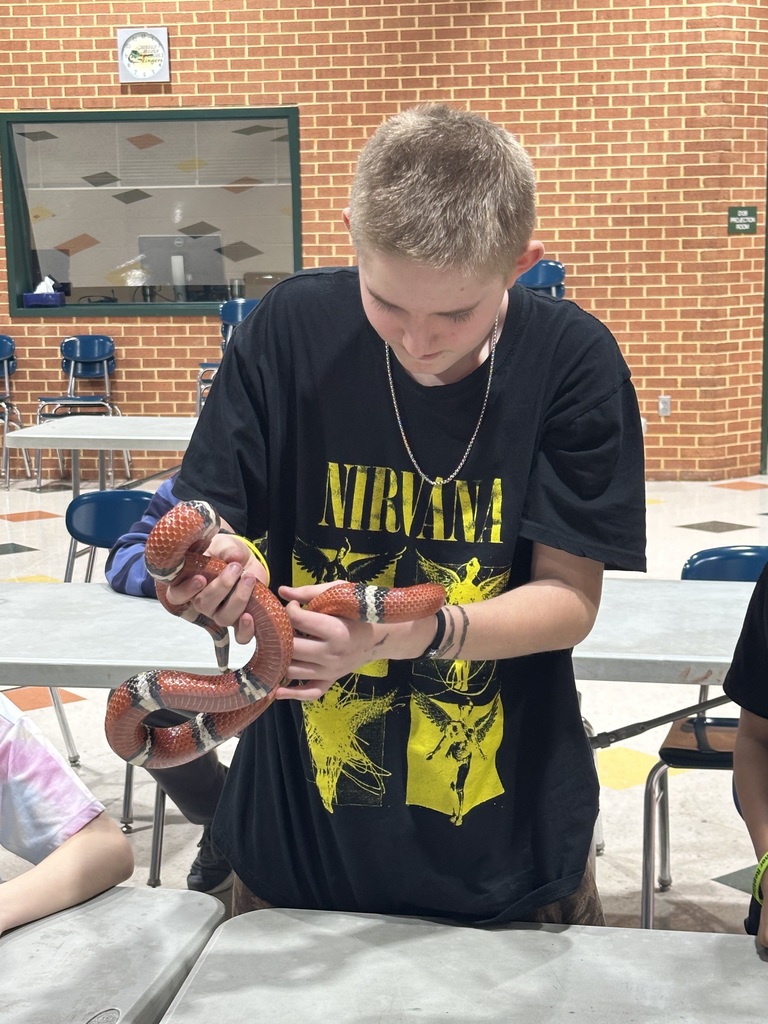 Student holding snake