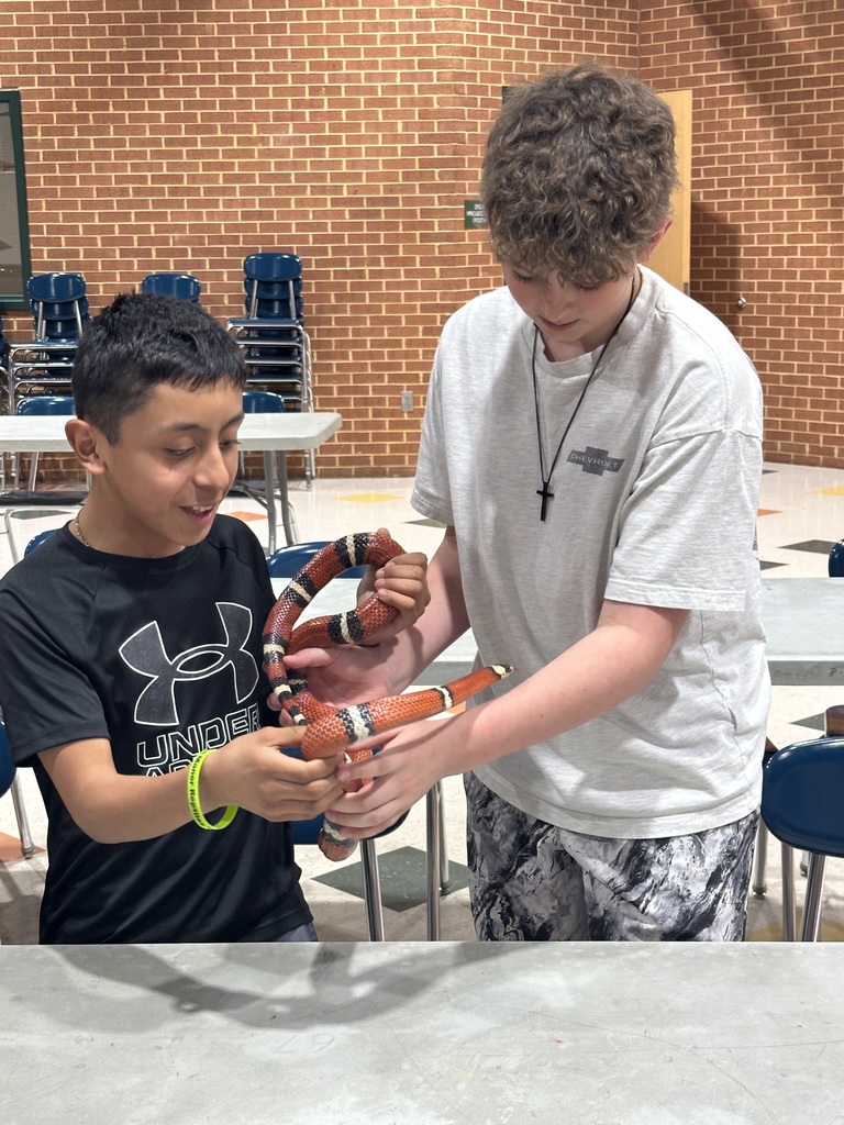 Student holding snake