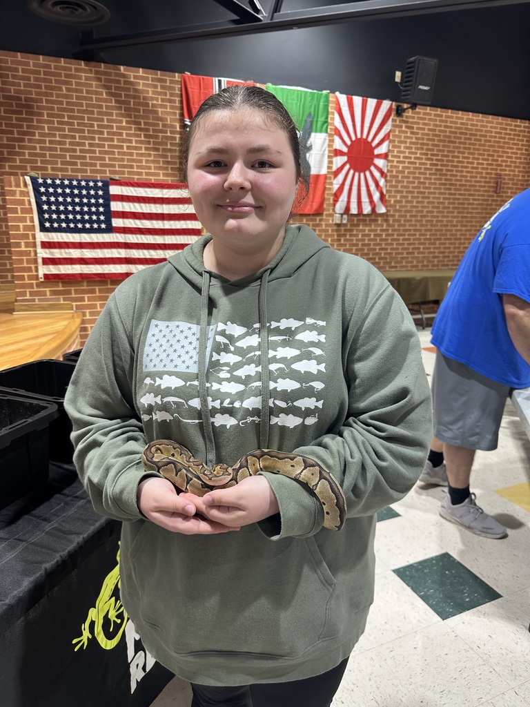 Student holding snake