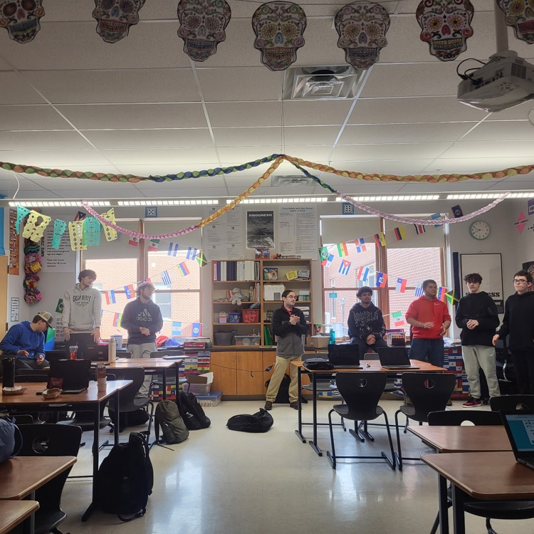 Seniora Carey engages her Spanish class through movement, singing, and full group practice with interacting in Spanish (along with some candy rewards). The class is energetic and fun with all students participating!
