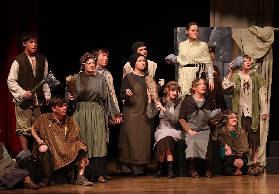 One act ensemble performs on stage