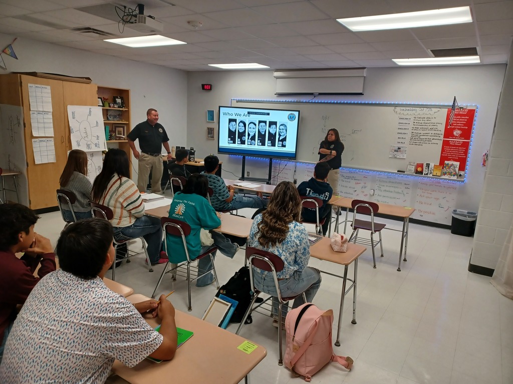 Victoria Disaster Response Team member speaks to a group of students.