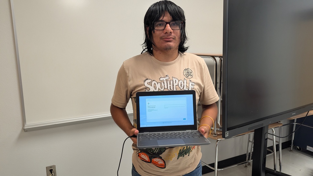 Students repairing Chromebooks