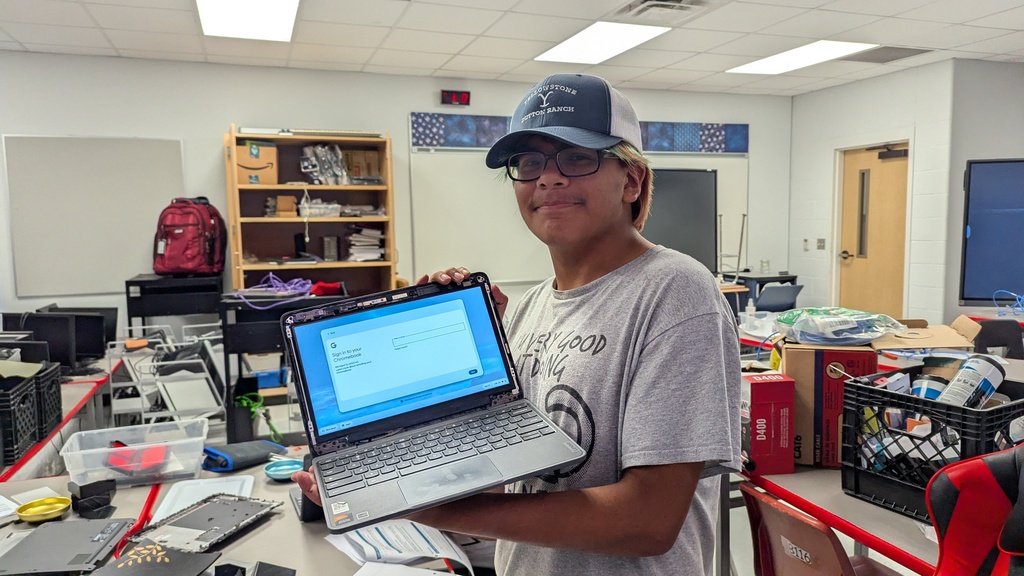 Students repairing Chromebooks