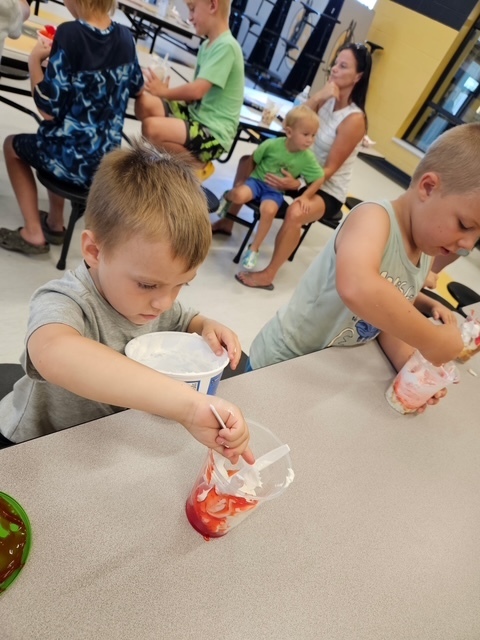 Pictured students making a sweet treat. 