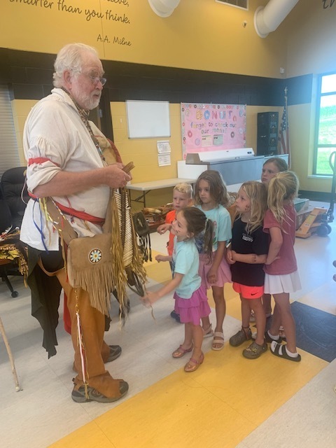 Students waiting in line to view artifacts