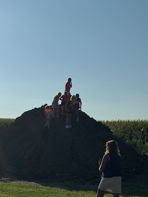 kids plying on top of dirt