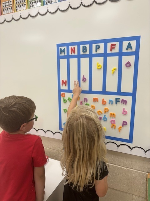students and letter board