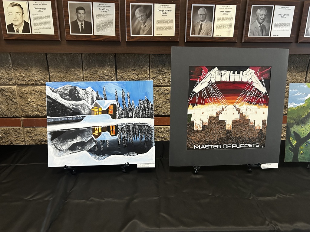 Acrylic painting of a mountain cabin beside a lake and acrylic painting of the Metallica- Master of Puppets Album Cover