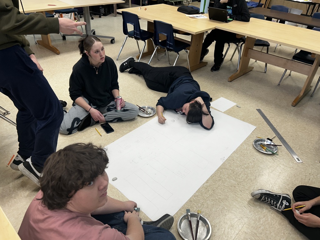 Students discuss the topic of "Legacy" and work on sketching out their ideas