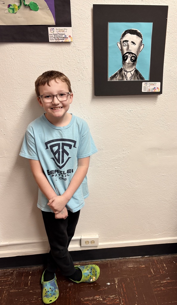 Zayne Hug is pictured beside his Salvador Dali pastel portrait.