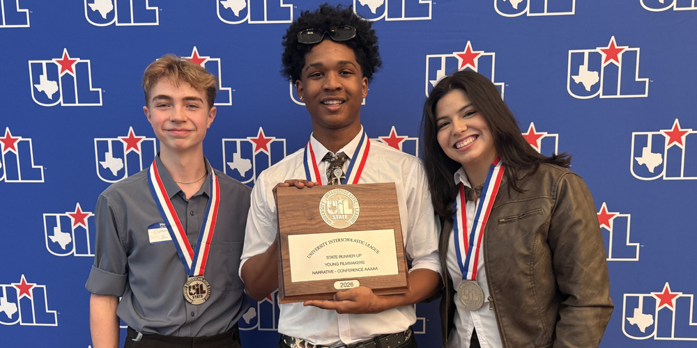 3 Azle High School students holding their 2nd place trophy from the UIL State Film 