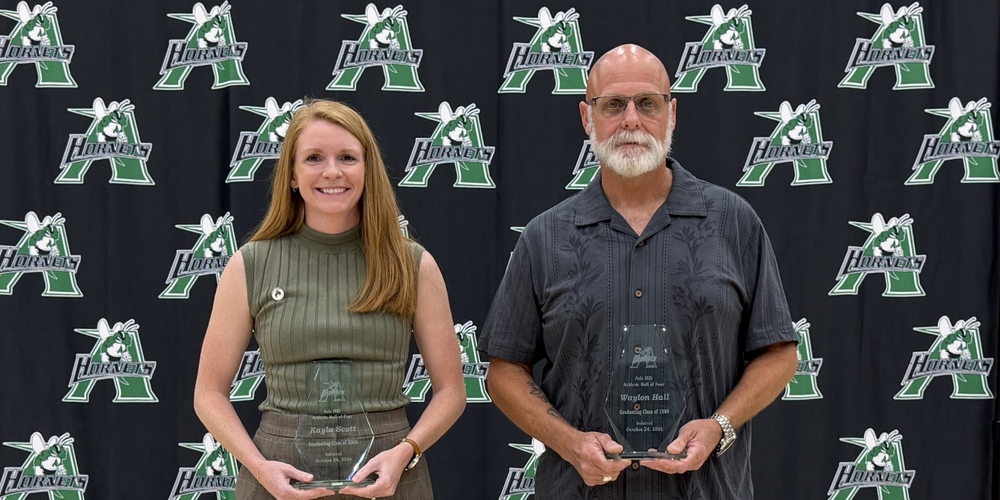 2026 Athletic Hall of Fame Inductees holding awards - Kayla Scott & Waylon Hall