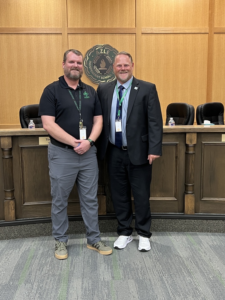 AHS teacher Jim Rider and principal Nate Driver standing in board room