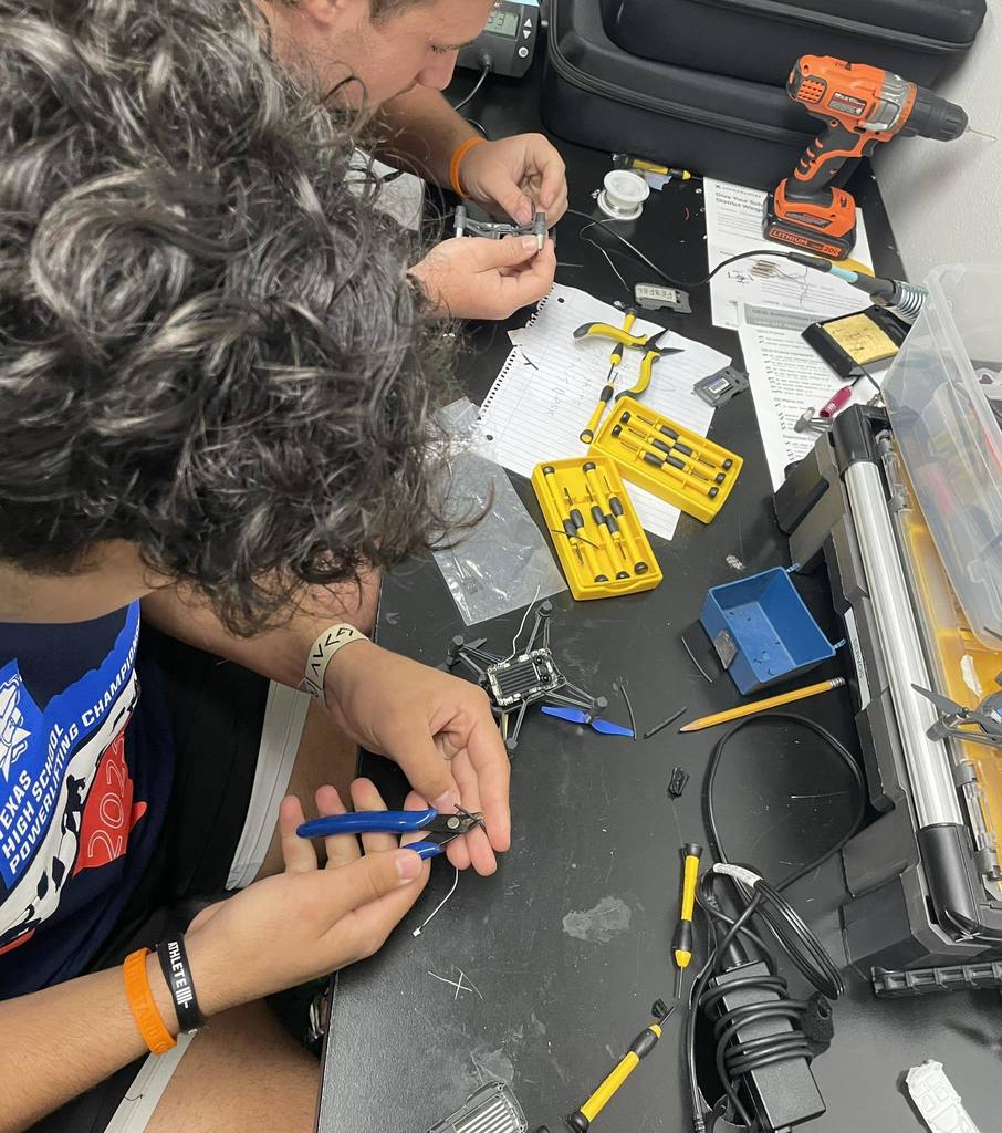 students working on drones
