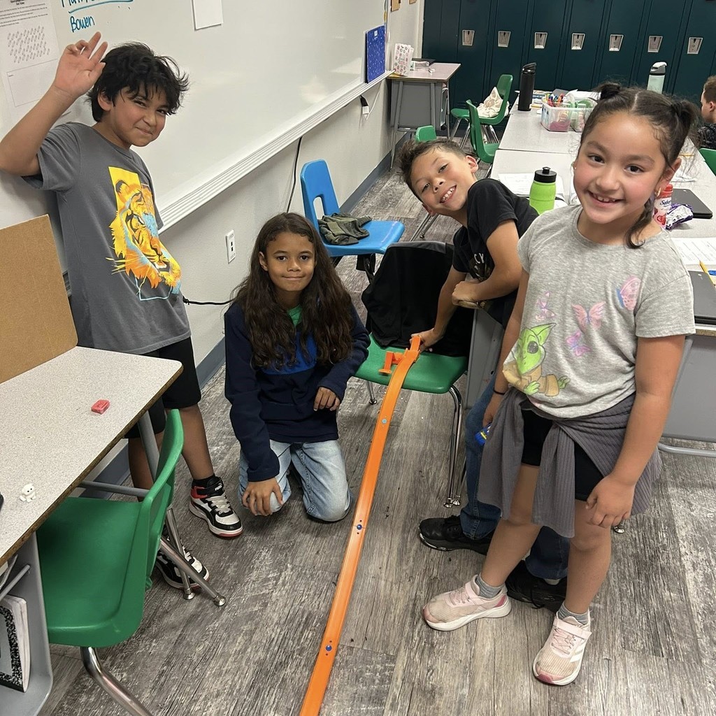 students with hot wheels ramp