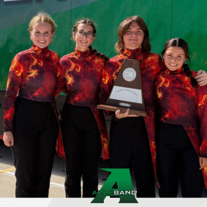 four band students wearing red shirts holding trophy