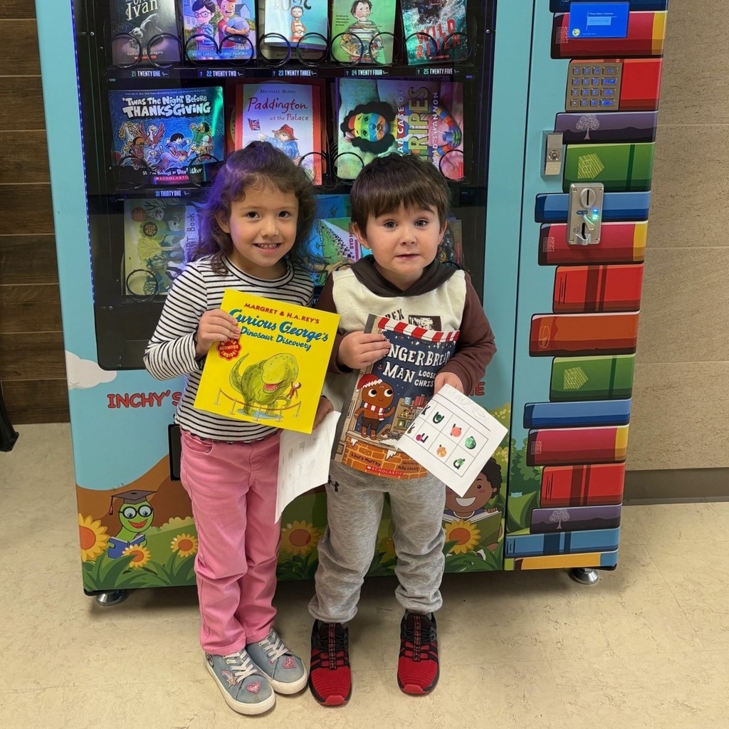 SC PreK students with books in front of book vending machine