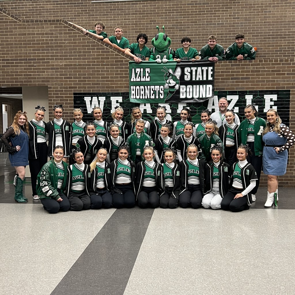 Azle High School cheerleaders and Buzzy with banner that says "Azle Hornets State Bound"