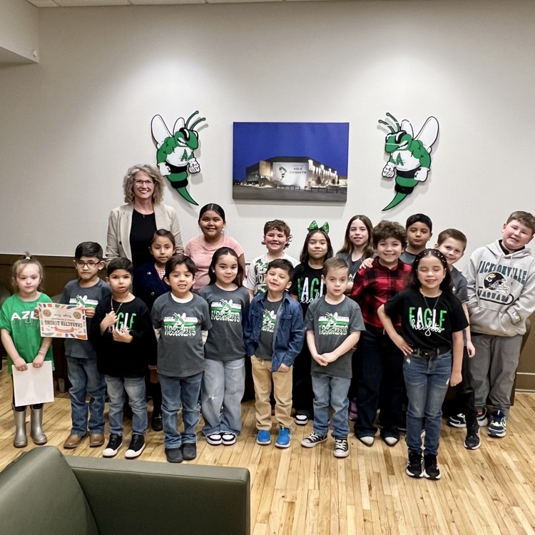 group of Eagle Heights Elementary students standing in front of Buzzy logos