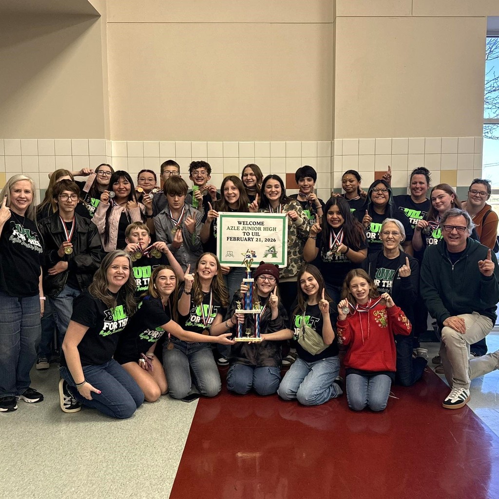 group of students wearing black shirts and award medals with trophy