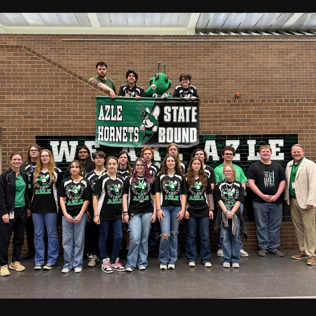 group of Archery students with "Azle Hornets State Bound" banner and Buzzy
