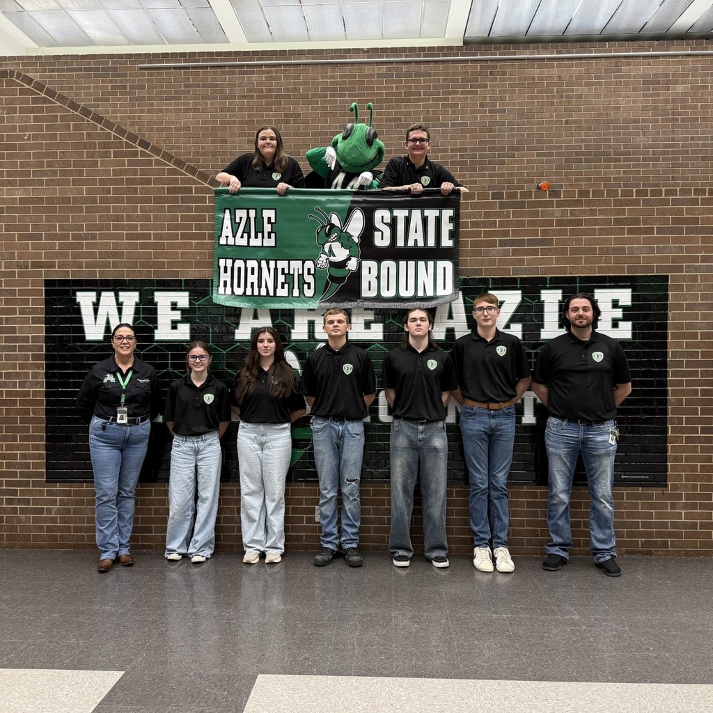 AHS Criminal Justice team wearing black shirts holding "Azle Hornets State Bound" banner with Buzzy