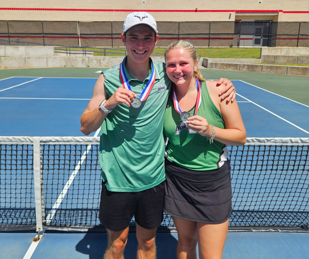 Chris Tomlinson and Story Hilliard with their silver medals after qualifying for the Regional tournament