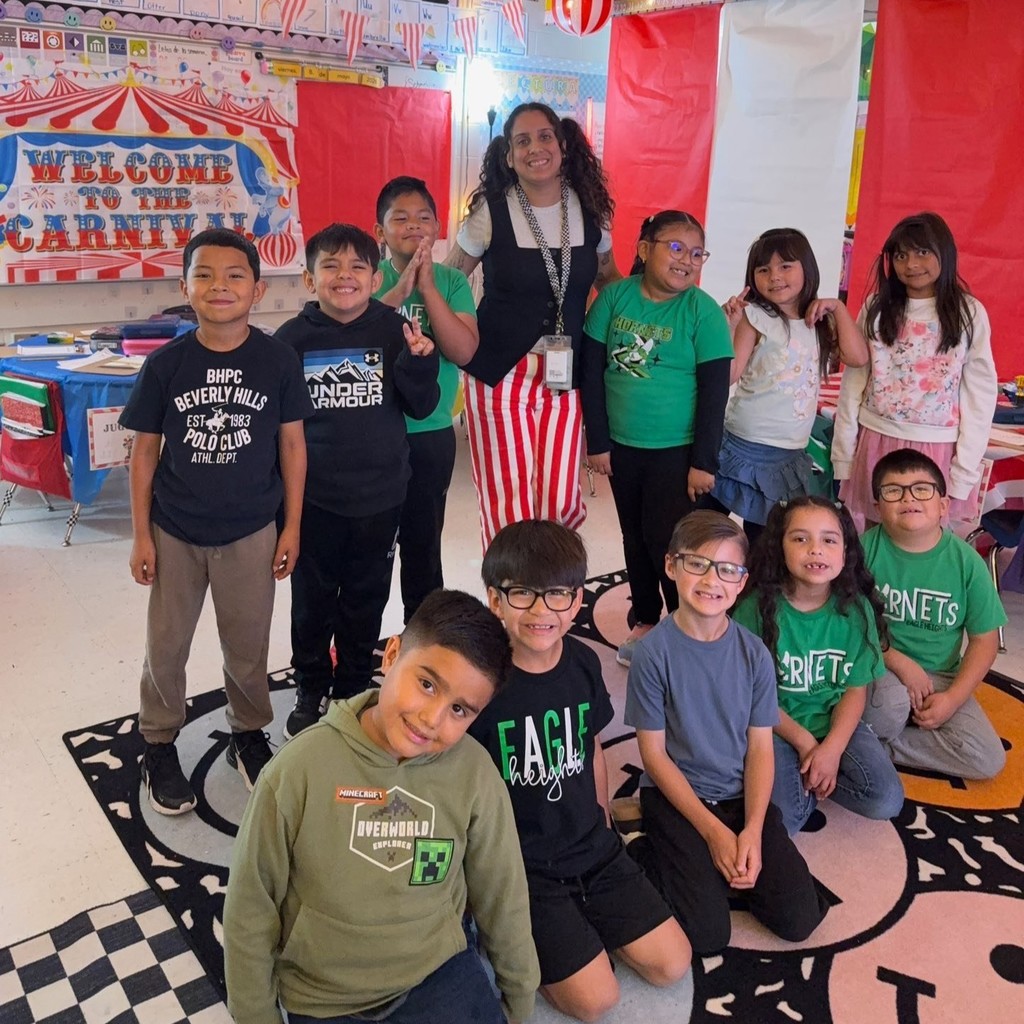 Group of students in front of Carnival banner