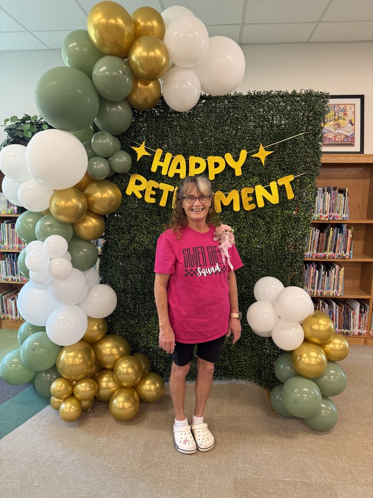 Picture of lady in front of happy retirement backdrop