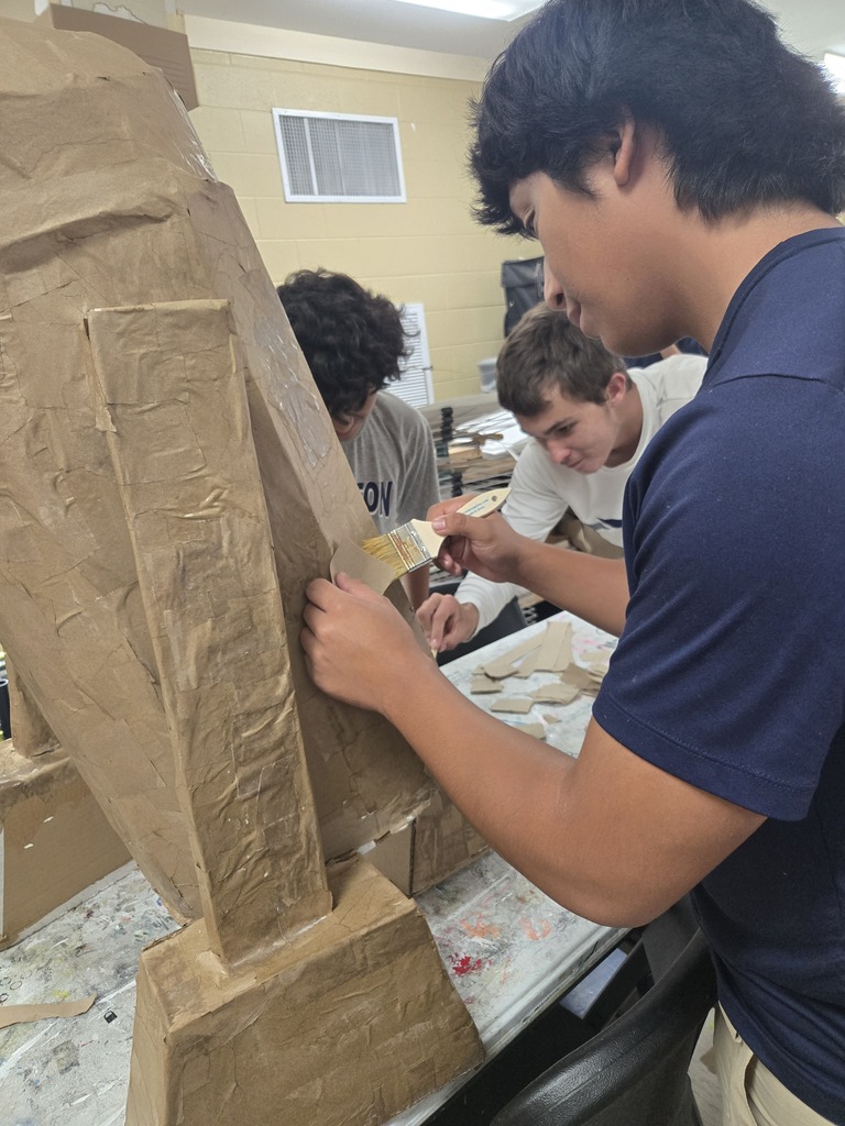 Art students creating 3-D objects