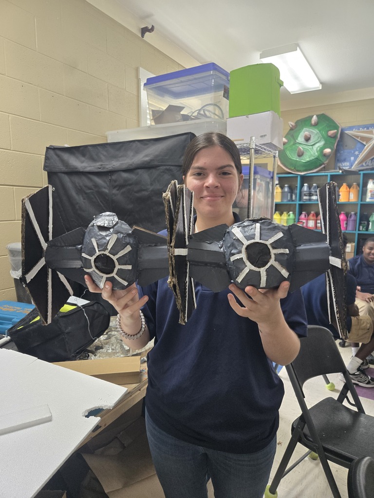 Art students creating 3-D objects