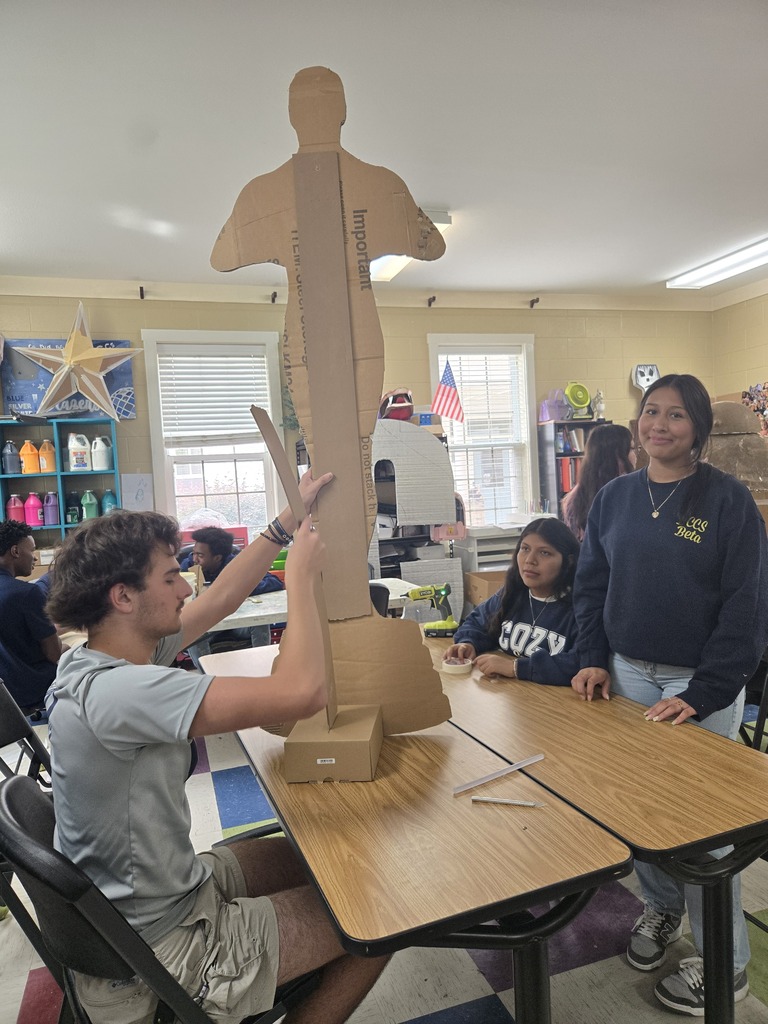 Art students creating 3-D objects