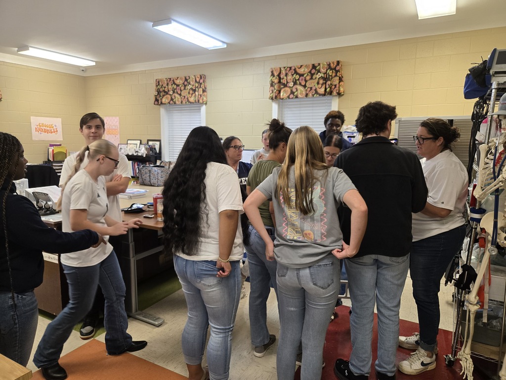 Allied Health students checking blood sugar levels of faculty members