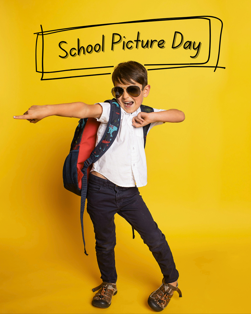 Young boy posing with sunglasses on and pointing a finger with yellow background.