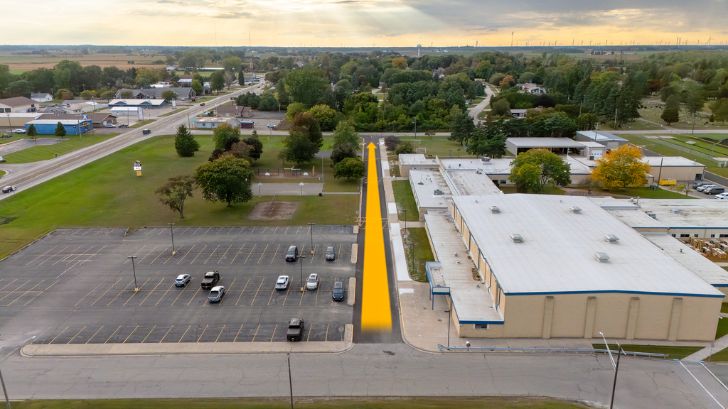 Bad Axe Middle School Aerial Shot with driveway path and arrow pointing east to west.