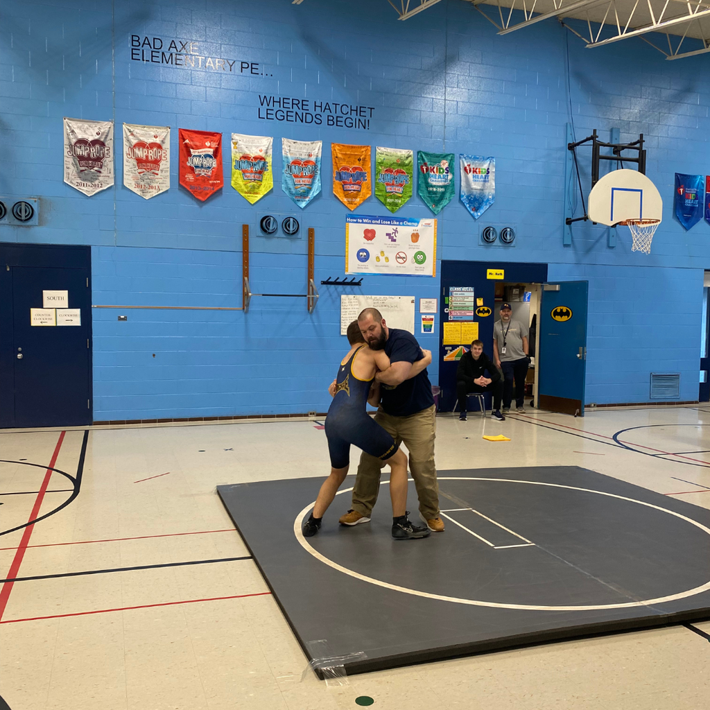 Bad Axe Varsity Wrestling Team with Coach Hollingsworth & Coach Sutherland teaching the 1st-graders how to wrestle.