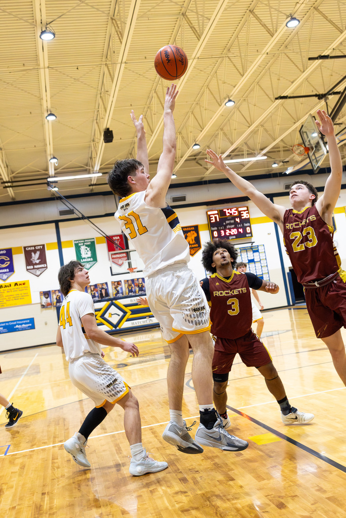 Play 31 on the Bad Axe Team goes to shoot the ball into the hoop. 