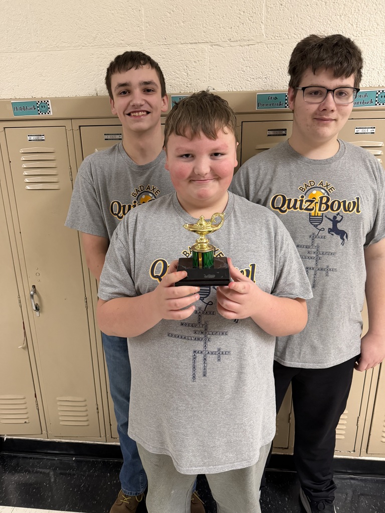 Bad Axe Hatchets Junior High Quiz Bowl Team holding trophy.
