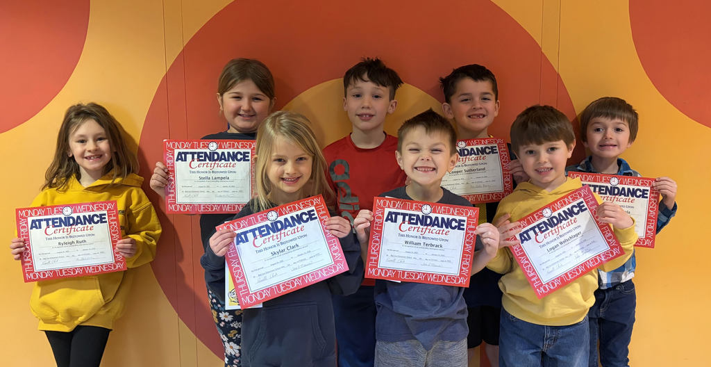 Bad Axe Elementary School Students pose with their "Perfect attendance semester 1" certificates.
